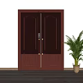 Dark Red Wooden Double Door With Decorative Panels And Golden Handles Beside Green Potted Plant