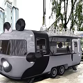 Modern Food Truck Parked On Urban Street With Pedestrians And Buildings