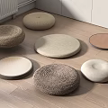 Round Floor Cushions With Various Woven And Fabric Textures On Wooden Floor