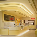 MISSOAKE Dessert Shop Bright Yellow Toned Interior With Open Counter And Dessert Display Shelves