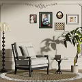 Gray Accent Chair with Armrests on Rug by Wall Art Floor Lamp and Green Plant