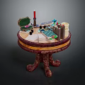 Vintage Round Wooden Table with Carved Legs and Items Like Open Box Candle Playing Cards
