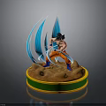Anime Dragon Ball Character Figure With Orange Outfit Blue Energy Waves And Brown Base