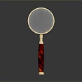 Red Handle Golden Frame Round Lens Magnifying Glass as Daily Living Supply on Dark Background