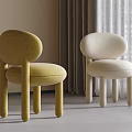 Modern Single Accent Chairs Yellow Cream Upholstered Rounded Backrest Cylindrical Legs Neutral Curtain Background