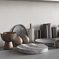 Assorted Kitchenware Display With Metal Marble Bowls Plates Cups On Neutral Countertop