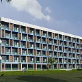 Modern Multi story School Building With Large Windows Balconies And Green Lawn