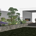 Serene Garden Space With Stone Wall Flower Bed Green Plants Seating Area Fireplace And Lush Lawn