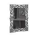 Decorative Mirror With Ornate Intricately Carved Frame Reflecting Artwork And Shelf Decor
