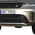Silver Land Rover Discovery SUV With Headlights And License Plate