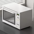 White Modern Microwave Oven Kitchen Appliance With Digital Display On Dark Countertop