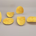 Golden Crunchy Potato Chips in Different Shapes Scattered on Gray Surface