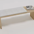 Simple Wooden Ottoman With Padded Seat And Stacked Magazines On Top