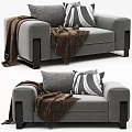 Modern Single Sofa in Gray and White with Striped Pillows Cozy Blankets and Metal Legs