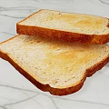 Freshly Toasted Golden Bread Slices with Crispy Edges on Marble Countertop