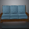 Three Seat Blue Sofa With Patterned Cushions Wooden Armrests And Base