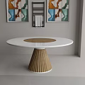 Modern Dining Room Featuring Round White Table With Wooden Pleated Leg And Framed Wall Art