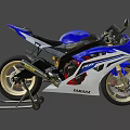 Yamaha R6 Sporty Motorcycle With Blue And White Body Gold Wheels And Black Seat