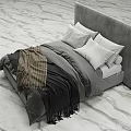 Modern Upholstered Double Bed With Light Grey Pillows And Dark Blanket On Marble Floor