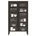 Elegant Dark Wood Sideboard With Glass Doors Displaying Dinnerware And Glassware