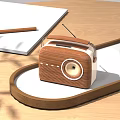 Wooden Radio Audio Device On Wooden Tabletop With Notebook Pencil And White Cup