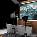 Photography Setup With Large Screen Displaying Castle Mountain Scene Camera On Tripod And Comfortable Chairs