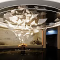 Modern Exhibition Space With Circular Ceiling Installation Floating Paper Pieces And Open Book 3d model