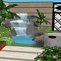 Rockery Stones In Modern Garden Landscaping With Green Plants And Water Features