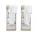 White Bathrobes On Wooden Bathroom Shelf With Folded Towels And Lotion Bottles