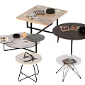 Various Modern Coffee Tables With Marble Black Tabletops Metal Frames And Magazines