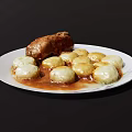 Roast Meat Roll With White Potato Balls In Brown Sauce On Decorative Plate