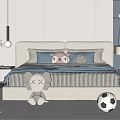 Cozy Double Bed With Blue Pillows Striped Bedspread Stuffed Toys Soccer Ball And Basketball