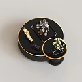 Modern Luxury Black Round Nesting Coffee Tables With Gold Rim And Delicate Tabletop Decorations