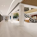 Modern Shopping Mall Interior With Escalators Hanging Lights Green Plants And MUJI Store