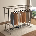 Stainless Steel Clothes Rack With Hanging Clothes And Shoes On Carpet In Room