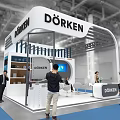 DÖRKEN Exhibition Booth Featuring Curved Roof Display Area Digital Screen Tables Chairs And People Visiting