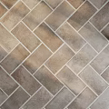Earthy Brown Herringbone Tile Floor With Textured Surface And Natural Light Shadows