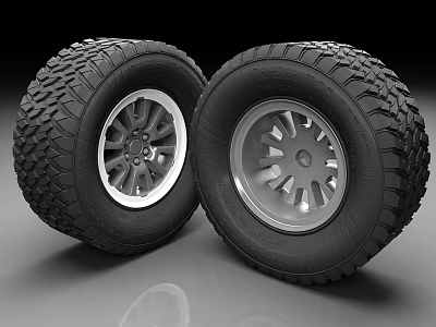 Off Road Tires With Silver Alloy Wheels And Deep Tread Pattern Design 3d model