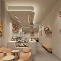 Modern Café Interior Design With Cake Display Counter Sofa Chairs Round Tables And Decorative Paintings