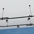 Black Ceiling Mounted Lighting Fixture Set With Multiple Adjustable Lights And Blue Wall 3d model