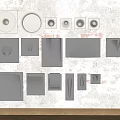 Modern Wall Decor Pieces In Gray White With Various Shapes On Textured Wall