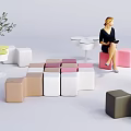 Public Chairs In Various Colors And Different Shapes With Small Tables And Green Plants