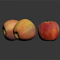 Three Fresh Apples With Red And Yellow Gradient On Black Reflective Surface