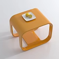 Modern Orange Coffee Table with White Plate Holding Fresh Lemons on White Surface