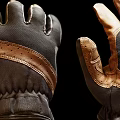 Pair of Brown and Black Leather Fabric Gloves With Detailed Stitching And Wrist Cuffs