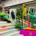 Colorful Display Cubes With Green Plants MAYA Sign And Photo Display In Exhibition