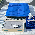 Industrial Factory Building Featuring Blue Roof White Tanks And Modern Construction Facilities