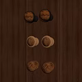 Wooden Cabinet Door Knobs With Gold Metal Accents On Dark Wood Surface