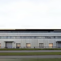 Modern Industrial Factory Building With Metal Panel Facade And Large Windows