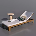 Wooden Frame Lounge Chair With White Cushion Striped Pillow Folded Towel And Round Side Table